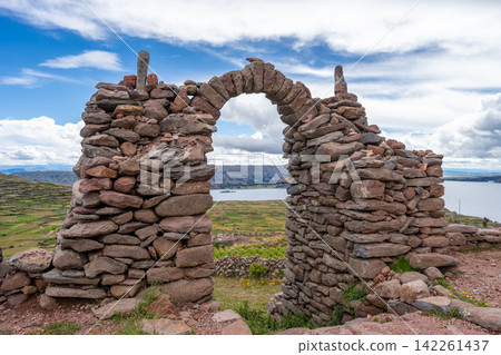 Stone pathway and arch at Pachatata archaeological site, Amantani Island, La ke Titicaca, Peru Stone pathway and arch at Pachatata archaeological site, Amantani Island, La ke Titicaca, Peru 142261437