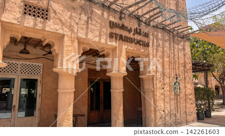Starbucks in a traditional building in Dubai Al Seef Starbucks in a traditional building in Dubai Al Seef 142261603