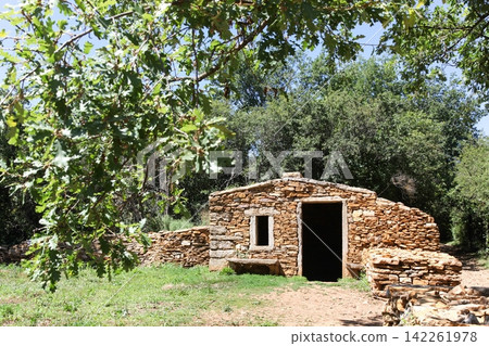 Old and typical stone hut called caborne in French language in Saint Cyr au Mont d'or, France Old and typical stone hut called caborne in French language in Saint Cyr au Mont d'or, France 142261978