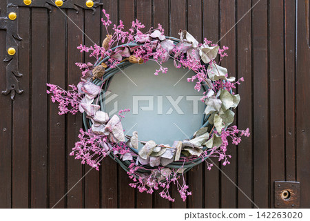 Dried Pink Gypsophila Wreath With Eucalyptus on Wooden Door 142263020