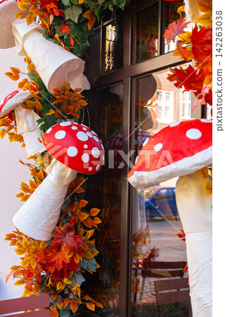 Decorative Autumn Fly Agaric Mushrooms Adorning Building Facade and Windows Decorative Autumn Fly Agaric Mushrooms Adorning Building Facade and Windows 142263038