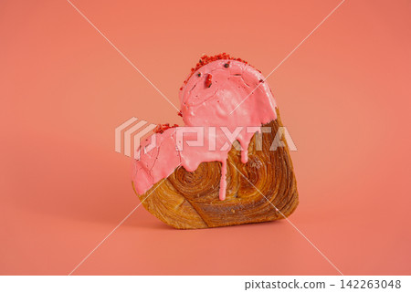 Heart shaped strawberry berry croissant on pink background with copy space. Puff pastry new trendy sweet dessert bakery. Creamy dough Heart shaped strawberry berry croissant on pink background with copy space. Puff pastry new trendy sweet dessert bakery. Creamy dough 142263048