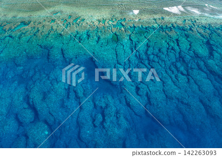 Geometric patterns of coral reefs stretching out off the coast of Ingya, captured by drone aerial photography. Geometric patterns of coral reefs stretching out off the coast of Ingya, captured by drone aerial photography. 142263093