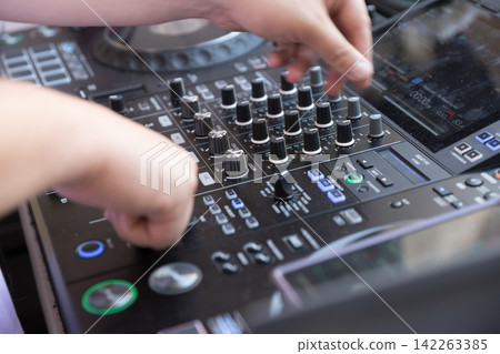 DJ Hands Operating Professional Mixing Console DJ Hands Operating Professional Mixing Console 142263385