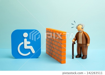 An elderly man is separated from disability status by a wall. Bureaucratic, psychological or information barriers. Government assistance and official recognition remain difficult to access. An elderly man is separated from disability status by a wall. Bureaucratic, psychological or information barriers. Government assistance and official recognition remain difficult to access. 142263511