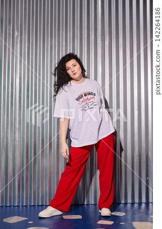 Stylish woman exudes authentic lifestyle aura with gentle studio lighting Stylish woman exudes authentic lifestyle aura with gentle studio lighting 142264186
