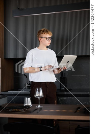 Young man adjusting notes before informal client meeting Young man adjusting notes before informal client meeting 142264477
