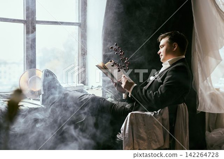 Contemplative scene with artistic ambiance and thoughtful man 142264728