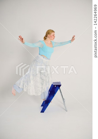 Bright minimalist studio hosts woman with lace skirt performing Bright minimalist studio hosts woman with lace skirt performing 142264969