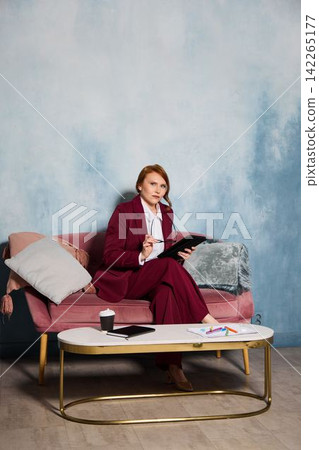 Individual editing manuscript with tools on comfortable furniture Individual editing manuscript with tools on comfortable furniture 142265177