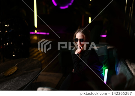 Creative director woman in neon, latenight brainstorm Creative director woman in neon, latenight brainstorm 142265297