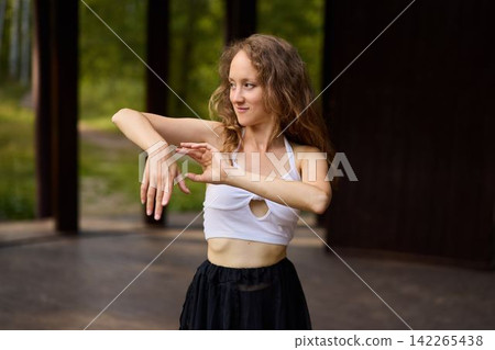 Rehearsal environment featuring focused dancer and serene scenery Rehearsal environment featuring focused dancer and serene scenery 142265438