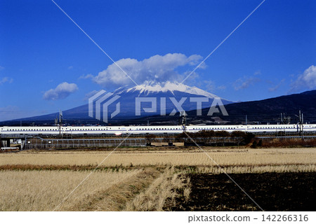 2008: The Tokaido Shinkansen N700 series Nozomi train running with Mount Fuji in the background. 2008: The Tokaido Shinkansen N700 series Nozomi train running with Mount Fuji in the background. 142266316