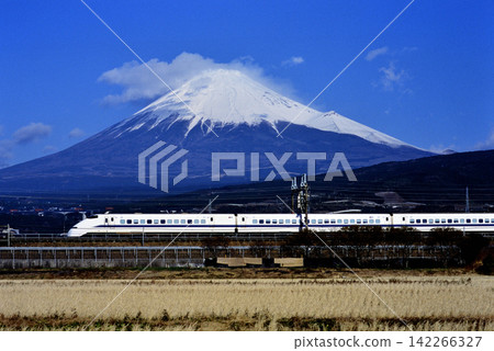 2008: Tokaido Shinkansen 300 series Hikari train running with Mount Fuji in the background. 2008: Tokaido Shinkansen 300 series Hikari train running with Mount Fuji in the background. 142266327