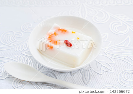 A smooth and silky almond tofu and citrus dessert. A smooth and silky almond tofu and citrus dessert. 142266672