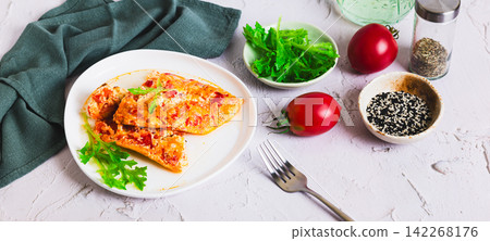 Airy egg omelette with tomatoes on a plate on the table web banner Airy egg omelette with tomatoes on a plate on the table web banner 142268176