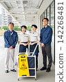 Four men and women who are staff members for building cleaning and facility maintenance. 142268481