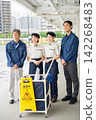 Four men and women who are staff members for building cleaning and facility maintenance. 142268483