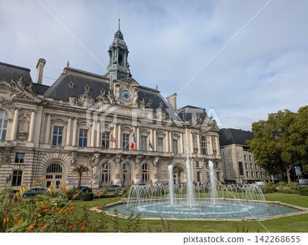 A beautiful fountain rising from the square in front of the Tours City Hall in France. A beautiful fountain rising from the square in front of the Tours City Hall in France. 142268655