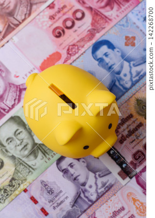 A piggy bank as a concept for storing, accumulating, and saving financial resources A piggy bank as a concept for storing, accumulating, and saving financial resources 142268700