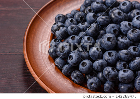 Fresh, ripe, and juicy wild blueberries as an ingredient for vegetarian dishes Fresh, ripe, and juicy wild blueberries as an ingredient for vegetarian dishes 142269473