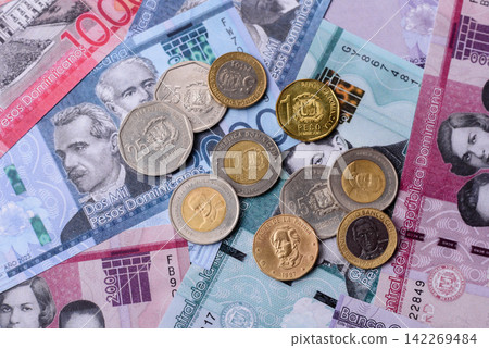 Dominican peso banknotes and coins as a instrument of trade and exchange. Dominican peso Dominican peso banknotes and coins as a instrument of trade and exchange. Dominican peso 142269484