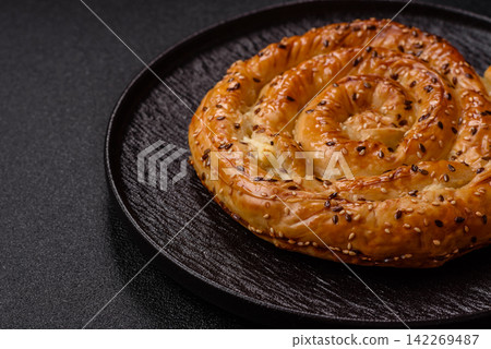 Greek cheese and sesame pie, a traditional Balkan dish. Balkan pie Greek cheese and sesame pie, a traditional Balkan dish. Balkan pie 142269487