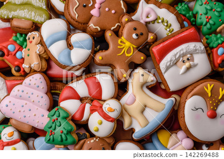 Gingerbread as a Christmas staple, sweets for the holiday interior. Gingerbread as a background Gingerbread as a Christmas staple, sweets for the holiday interior. Gingerbread as a background 142269488