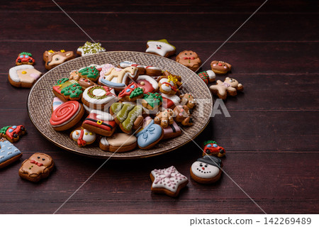Gingerbread as a Christmas staple, sweets for the holiday interior. Gingerbread as a background Gingerbread as a Christmas staple, sweets for the holiday interior. Gingerbread as a background 142269489