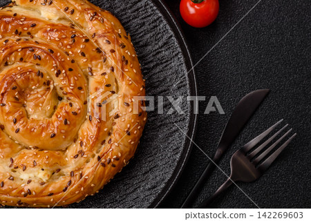 Greek cheese and sesame pie, a traditional Balkan dish. Balkan pie Greek cheese and sesame pie, a traditional Balkan dish. Balkan pie 142269603