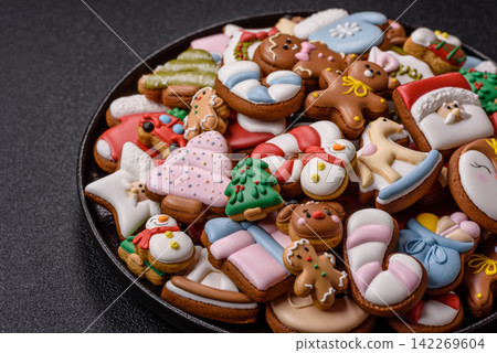 Gingerbread as a Christmas staple, sweets for the holiday interior. Gingerbread as a background Gingerbread as a Christmas staple, sweets for the holiday interior. Gingerbread as a background 142269604