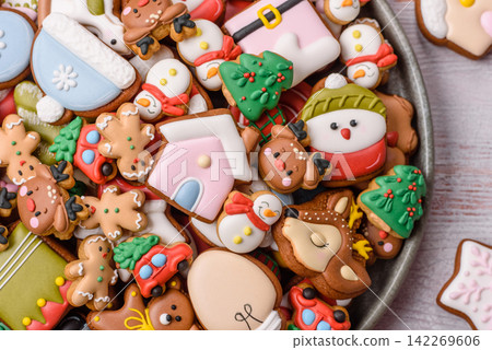 Gingerbread as a Christmas staple, sweets for the holiday interior. Gingerbread as a background Gingerbread as a Christmas staple, sweets for the holiday interior. Gingerbread as a background 142269606