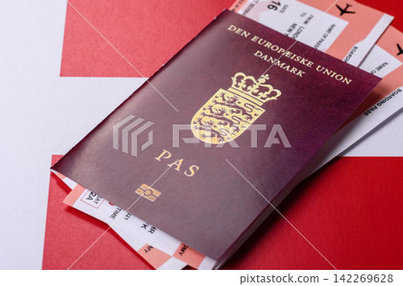 Denmark, Danish passport or id document with tickets for flight, travel. Danish passport Denmark, Danish passport or id document with tickets for flight, travel. Danish passport 142269628