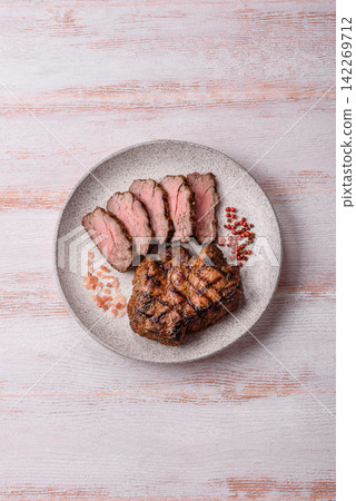Grilled beef or pork steak seasoned with salt and allspice. Grilled steak Grilled beef or pork steak seasoned with salt and allspice. Grilled steak 142269712