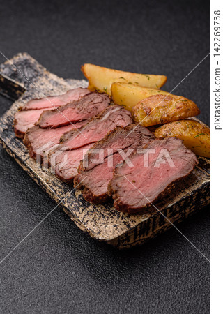 Grilled beef or pork steak seasoned with salt and allspice. Grilled steak Grilled beef or pork steak seasoned with salt and allspice. Grilled steak 142269738