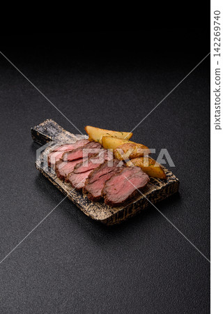 Grilled beef or pork steak seasoned with salt and allspice. Grilled steak Grilled beef or pork steak seasoned with salt and allspice. Grilled steak 142269740