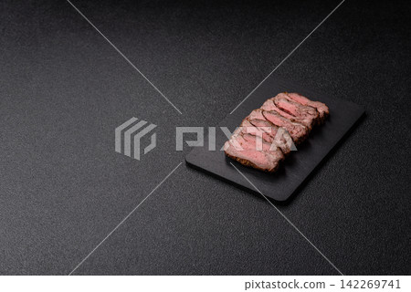 Grilled beef or pork steak seasoned with salt and allspice. Grilled steak Grilled beef or pork steak seasoned with salt and allspice. Grilled steak 142269741