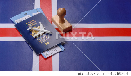 Iceland, Icelandic passport or id document with tickets for flight, travel. Icelandic passport Iceland, Icelandic passport or id document with tickets for flight, travel. Icelandic passport 142269824