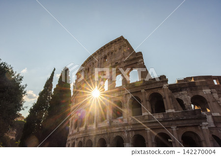 Sunburst Through Arches of Rome's Colosseum Sunburst Through Arches of Rome's Colosseum 142270004