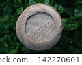 Woven Bamboo Pattern on green leaf Background. 142270601