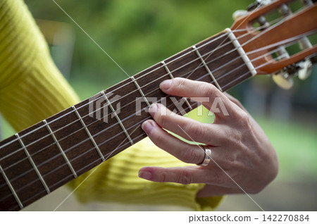 Closeup of playing classical guitar Closeup of playing classical guitar 142270884