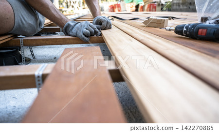 Installing wooden deck boards with hidden fasteners Installing wooden deck boards with hidden fasteners 142270885