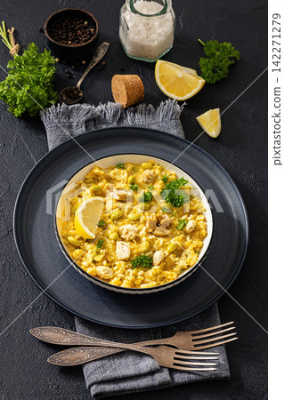 Creamy saffron chicken risotto in a bowl, top view Creamy saffron chicken risotto in a bowl, top view 142271279