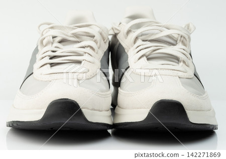 Sport shoes on display with white and black colors Sport shoes on display with white and black colors 142271869
