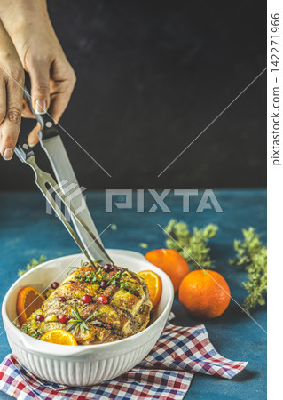 Color of 2020 year. Classic Blue, food trendy background. Roasted pork in white dish, christmas baked ham with cranberries, tangerines, thyme, rosemary, garlic Color of 2020 year. Classic Blue, food trendy background. Roasted pork in white dish, christmas baked ham with cranberries, tangerines, thyme, rosemary, garlic 142271966