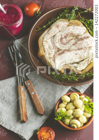 Baking pork lard bacon fatback with black pepper and other herbs and spices in ceramic dish. Traditional Ukrainian, Hungarian, Polish or other Eastern Europe national dish Baking pork lard bacon fatback with black pepper and other herbs and spices in ceramic dish. Traditional Ukrainian, Hungarian, Polish or other Eastern Europe national dish 142272003