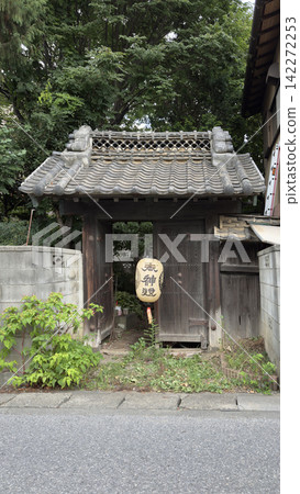 Lanterns and an old gate at a summer festival Lanterns and an old gate at a summer festival 142272253