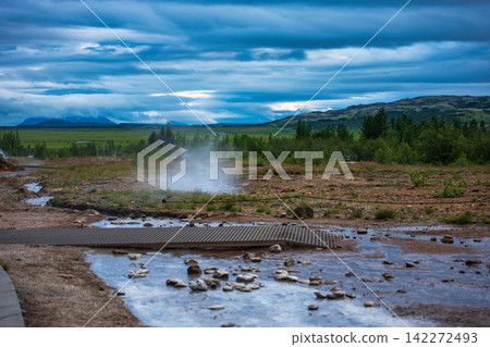 Geothermal Hot Spring Steam and Mountain Landscape Iceland Geothermal Hot Spring Steam and Mountain Landscape Iceland 142272493