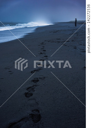 Footprints in Black Sand Beach at Dusk Iceland Footprints in Black Sand Beach at Dusk Iceland 142272536