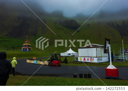 Colorful Festival Setup in Misty Mountain Valley Iceland 142272553